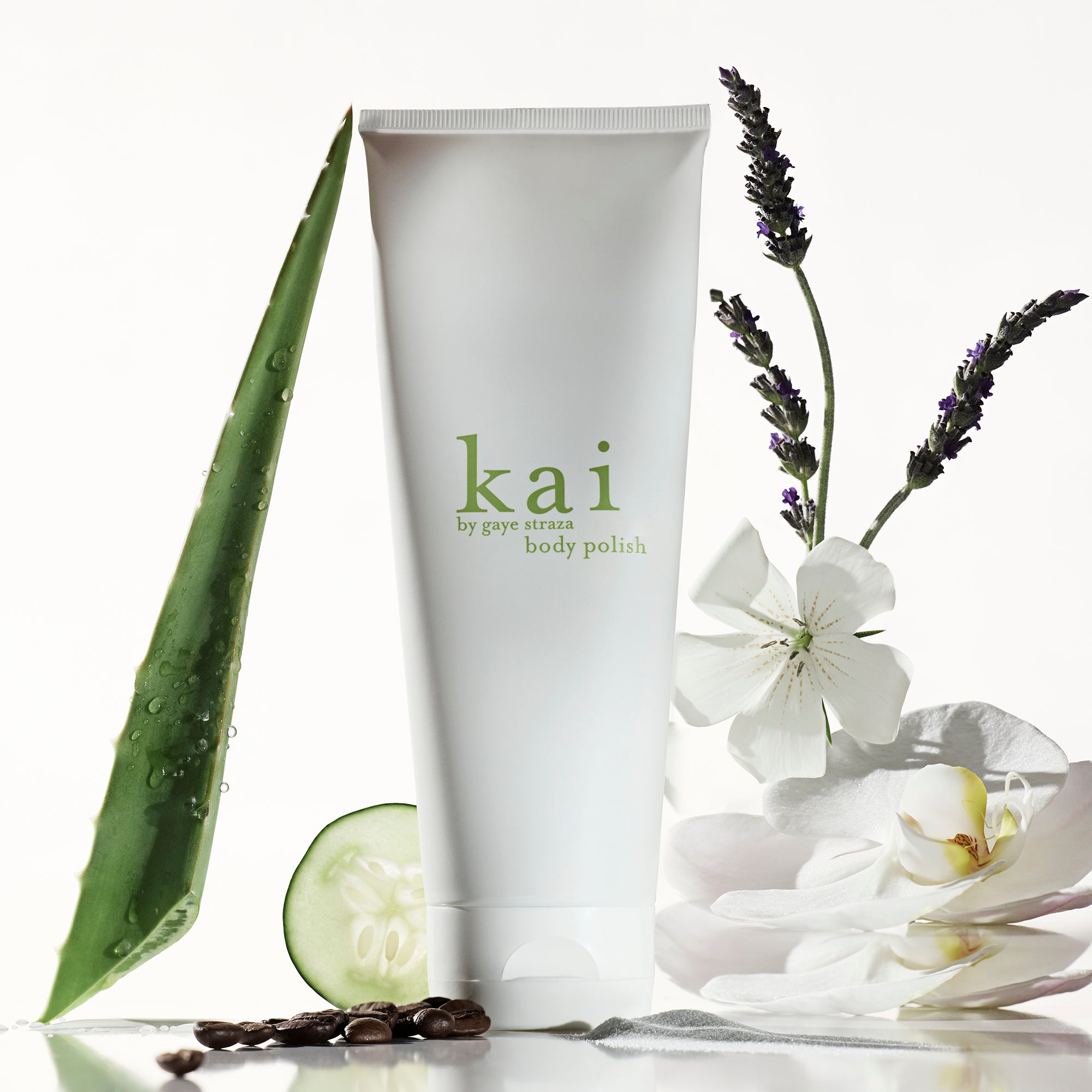 kai body polish tube with aloe leaf and coffee beans — hydrating sugar and sea salt body scrub