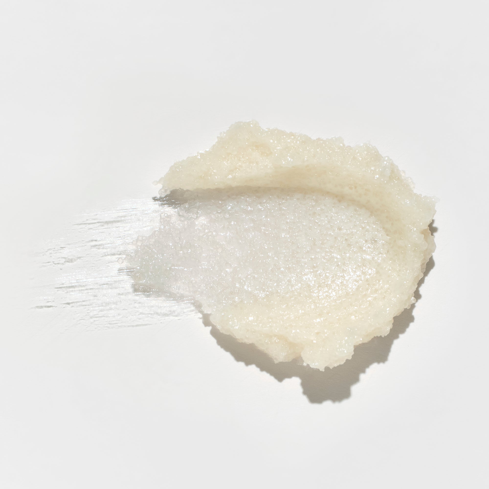 Close-up texture of kai exfoliating body scrub with coffee seed, aloe vera & chamomile